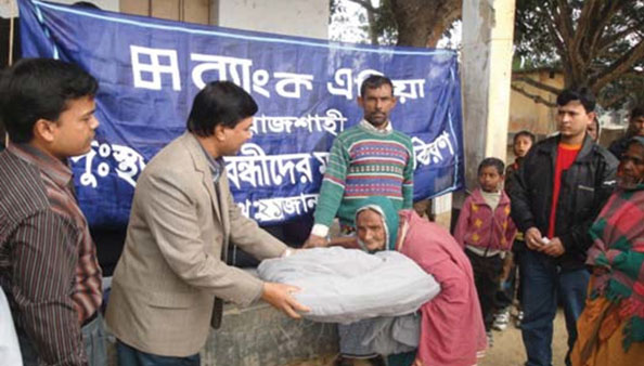 Distribution of warm cloths among cold-hit distressed people in Rajshahi